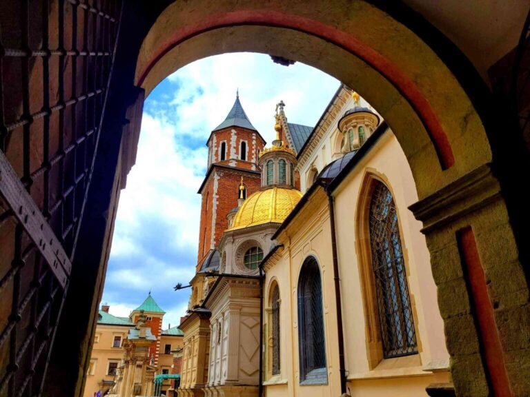 Atcracow Tour Arched Gate Golden Dome Brick Tower 