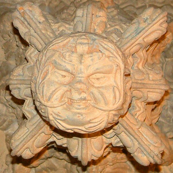 Highlandexperience Tour Carved Stone Face Sunburst Pattern