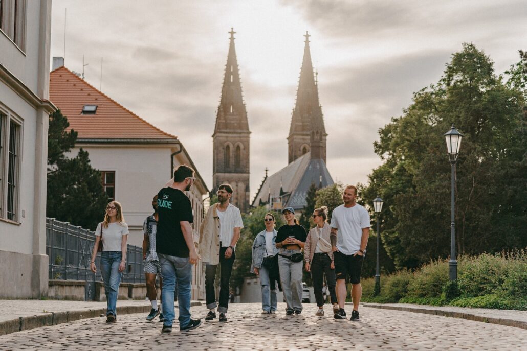 Segwayfun Tour Group Walking Cobblestone Street Church Towers 