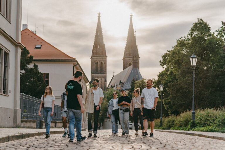 Segwayfun Tour Group Walking Cobblestone Street Church Towers 