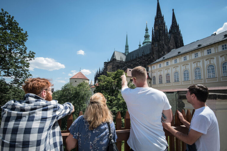 Segwayfun Tour Tourists Pointing Prague Castle