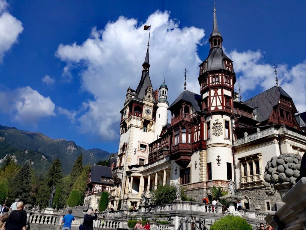 Transprotocol Tour Castle Tower People Clouds