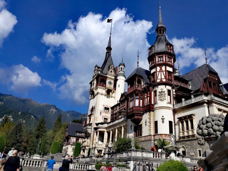 Transprotocol Tour Castle Tower People Clouds